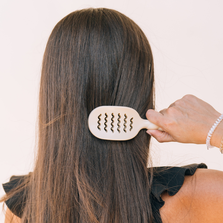 Mini Vented Brush | Tan shown in use. Compact, travel-friendly design. Available sizes: mini.
