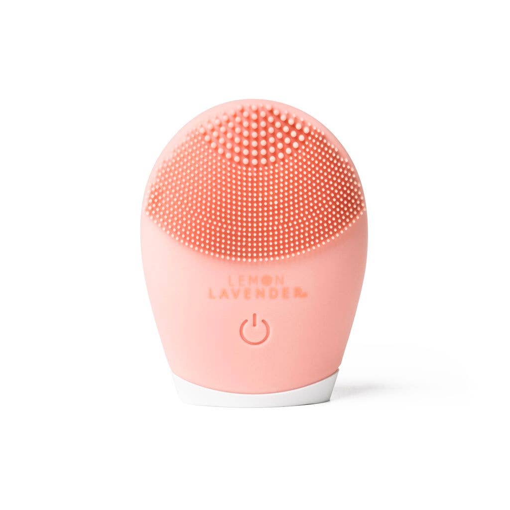 Pink Lemon Lavender Sonic Cleanser Brush with silicone bristles, textured tips, white base; available in one size.