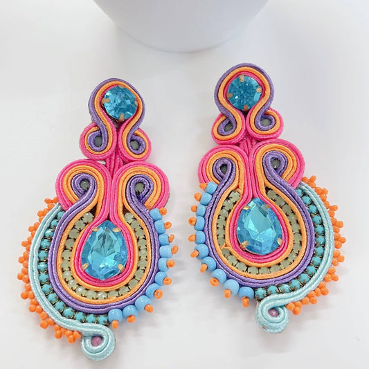 Courtney Multi Earrings: pink, orange, purple, blue beads with teardrop blue gems. Available in one size.