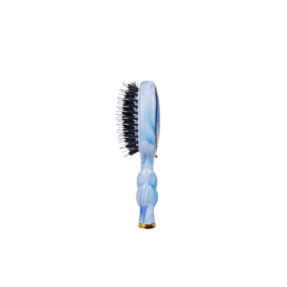 The Mini Boar Brush | Tide & True, with a blue marble-patterned handle and black and white natural boar bristles. Available in travel size.