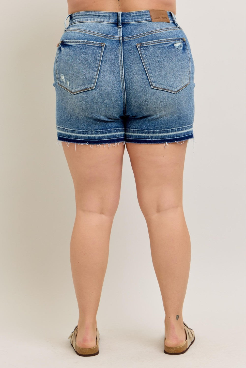 Judy Blue MR Tummy Control Vintage Wash Shorts with frayed hems, two back pockets. Available in sizes S-XL.