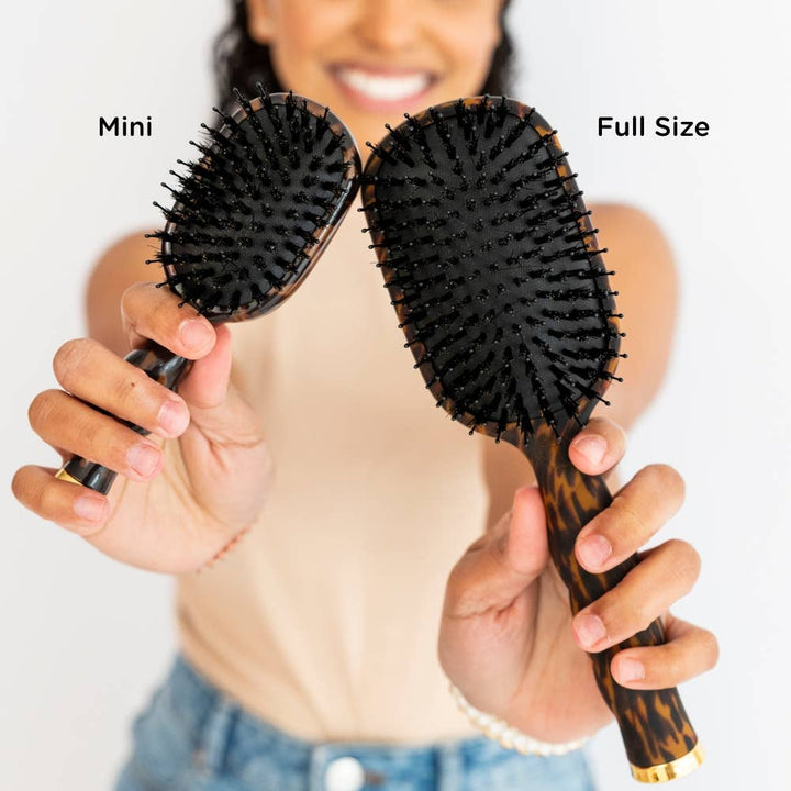 Mini Boar Brush | Tortoise hairbrush shown next to a full size version, highlighting the compact travel size and regular size options.
