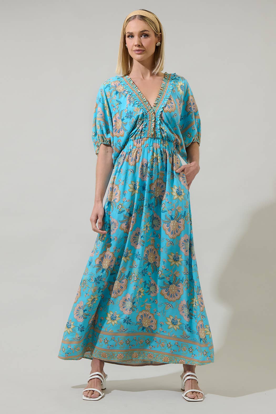 Raven Floral Hant V-Neck Midi Dress: blue, floral, ruffle details, short sleeves, V-neck. Sizes: XS-XL.