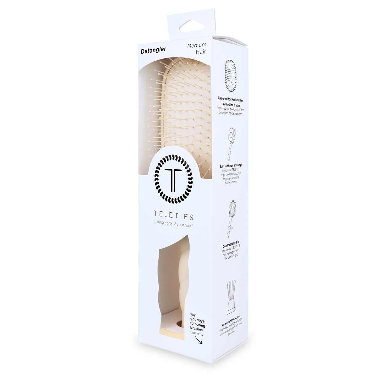 White rectangular box with clear window shows a tan Detangler Hair Brush for medium hair; simple illustrations and instructions on the side. Available in size for medium hair.