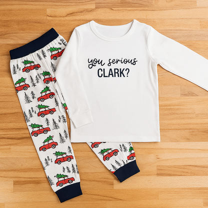 “You Serious Clark? Cotton 2-Piece Boy Clothes Set” in size 4-5T includes a white long-sleeve shirt with “You serious Clark?” print and matching pajama pants with red cars carrying Christmas trees, green trees, and black accents.