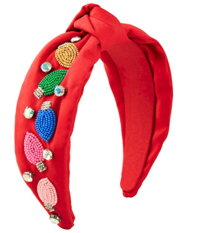 Red, padded headband with colorful beads and rhinestones. Beads in pink, blue, gold, and green. Ideal for holiday parties. Available sizes: S, M, L.