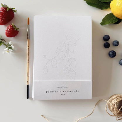 Fruit Paintable Watercolor Notecard Set includes notecards with a strawberry illustration and a paintbrush. Sizes available: standard card size.