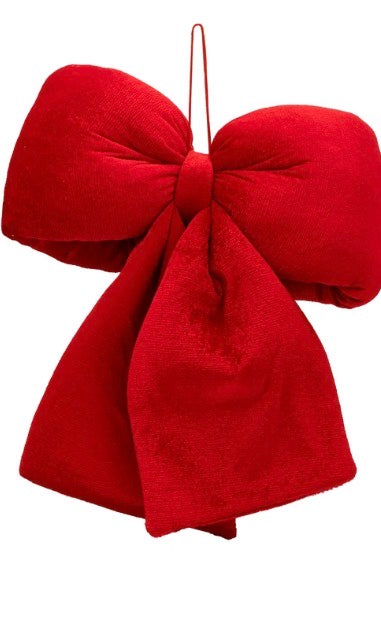 Large red velvet decorative bow with a hanging loop.
