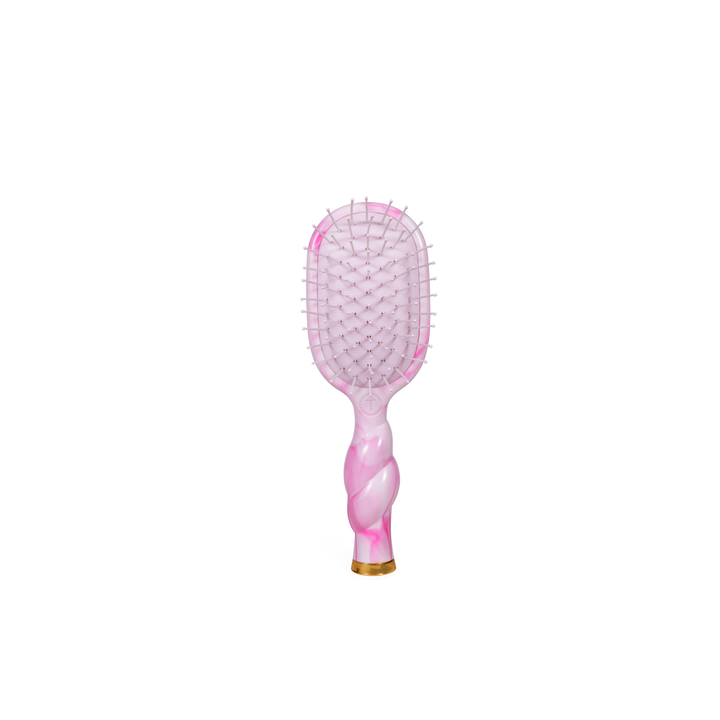 Mini Detangler Brush in “Pinch Me!” colorway with a pink rectangular head, twisted marbled handle, and gold detailing at the base. Available in mini size.