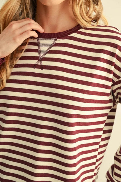 Burgundy Striped Sweatshirt with cream and maroon stripes. Available in sizes XS–XL.