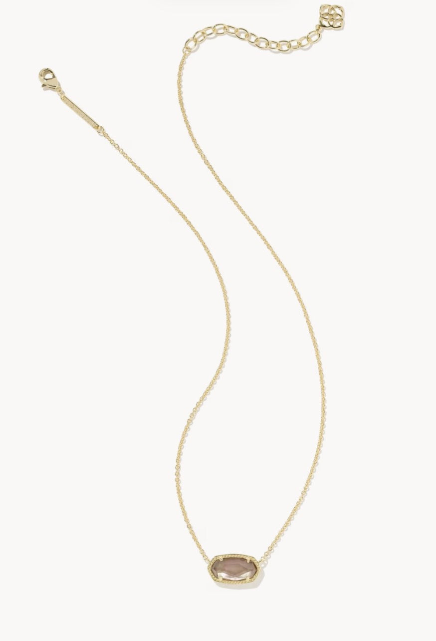 Elisa Necklace Gold Taupe by Kendra Scott is a short gold chain necklace with an adjustable clasp and a small oval taupe gemstone pendant in a gold frame. Available in one size.