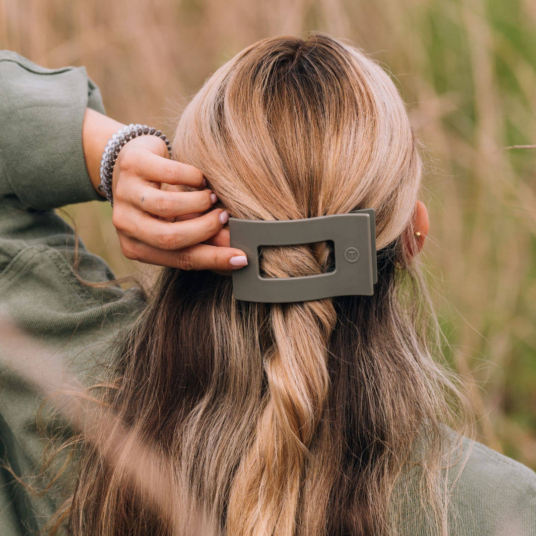 TELETIES Flat Rectangle Hair Clip shown in use. Available in small, medium, and large sizes.