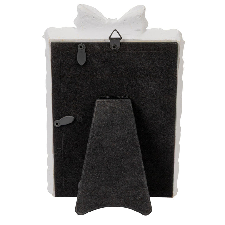 Plastic photo frame with bow, antique white edge, black stand, swivel tabs, metal hook. Fits 4x6 photos.