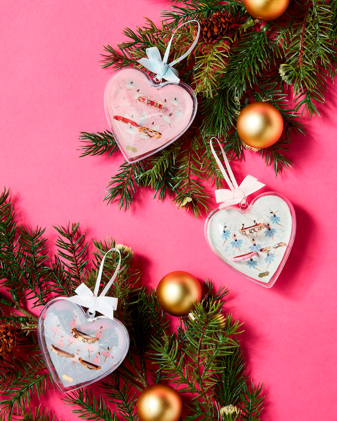 Three heart-shaped Ballerina Ornament Ring Set with bows; available in small, medium, and large sizes.