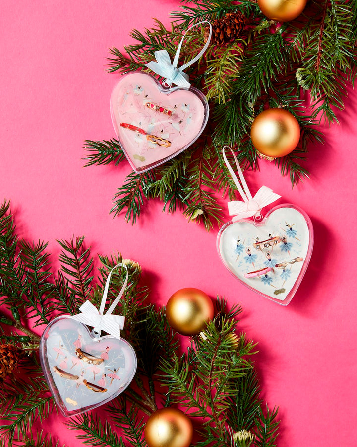 Three heart-shaped Ballerina Ornament Ring Set with bows; available in small, medium, and large sizes.