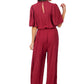 Annalise Jumpsuit: loose-fit polyester, short sleeves, back keyhole, removable waist tie. Available in sizes XS-XL.