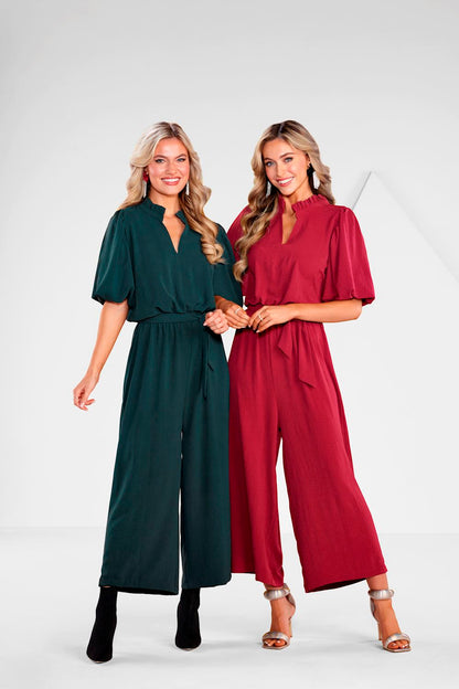 Annalise Jumpsuit shown in dark green and red; available in sizes XS-XL.
