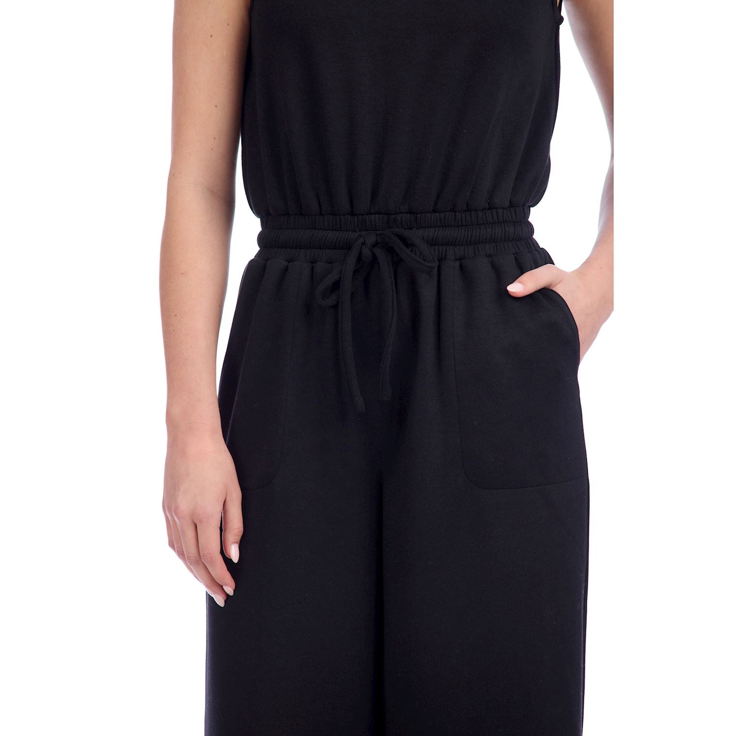 Atlas Jumpsuit: sleek black sleeveless design, available in sizes XS–XL.