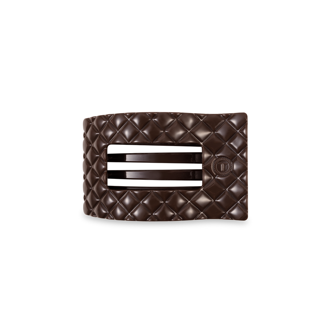 Dark brown TELETIES Flat Rectangle Hair Clip with quilted pattern, two horizontal slits, circular emblem; available in multiple sizes.