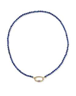 The Emery Beaded Strand Necklace has small dark blue beads, gold oval clasp; available in 16" and 18" lengths.