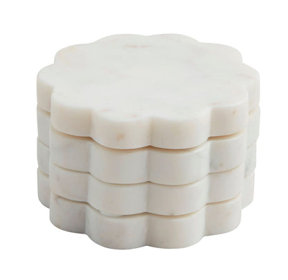 Set of four white marble beaded coasters with scalloped edges, each 4-inch diameter.