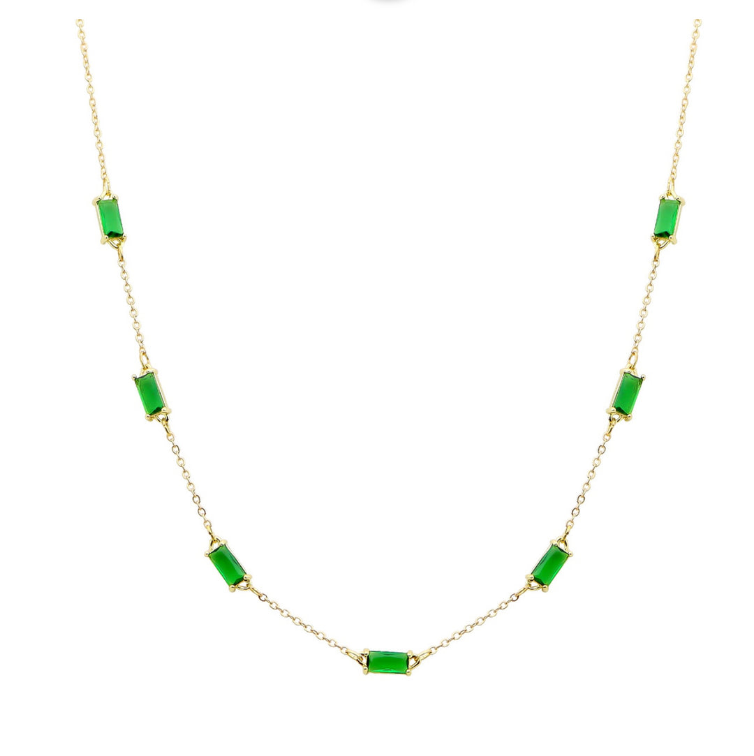 Delicate gold necklace with seven rectangular emerald stones, evenly spaced. Sizes available: 16", 18", and 20".