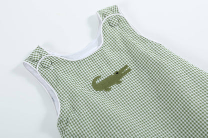 Green gingham alligator bubble romper with white piping, embroidered alligator on chest. Sizes: NB, 3M, 6M, 9M.