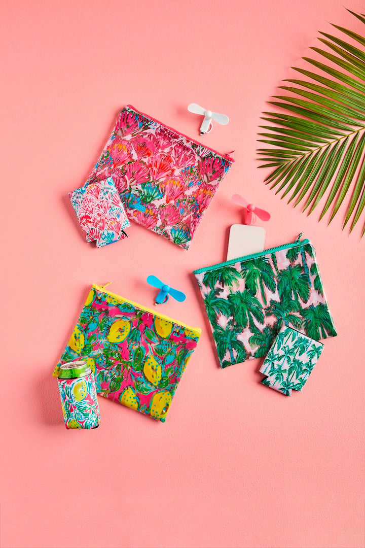 Beach Pouch Set: Colorful vinyl zipper cases in tropical prints, available in small, medium, and large sizes.