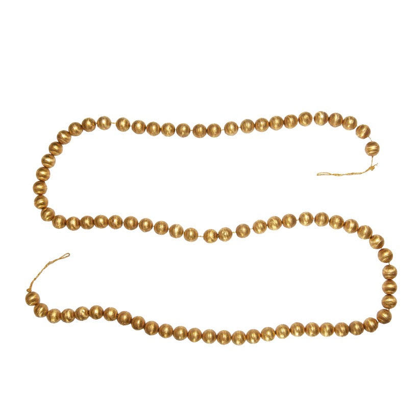 Handmade embossed gold-colored spherical metal bead ornament garland.