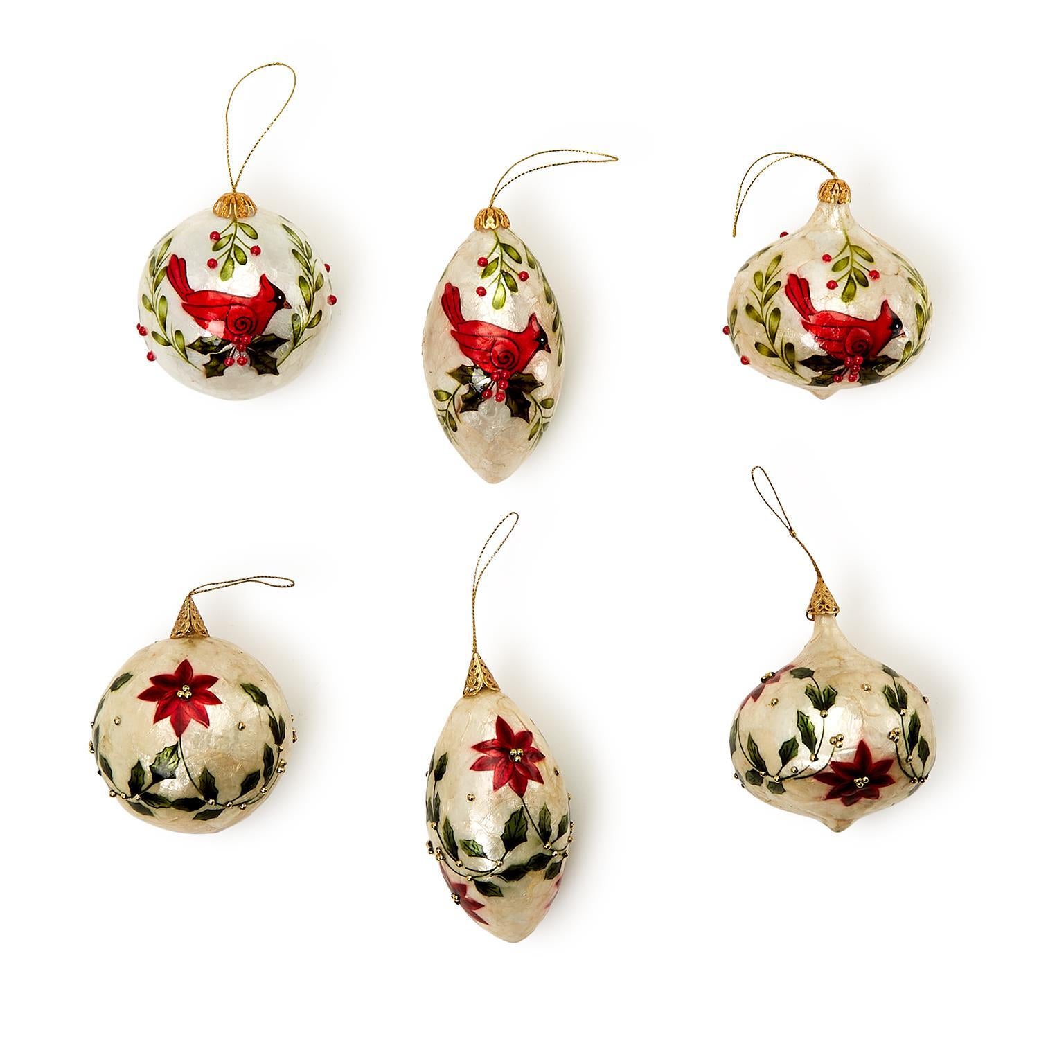 Hand-Painted Capiz Shell Cardinal Ornament collection: Set of six ornaments featuring cardinals and poinsettias. Made from Capiz shells, available in spherical and elongated shapes with a glossy finish and gold hanging cords.