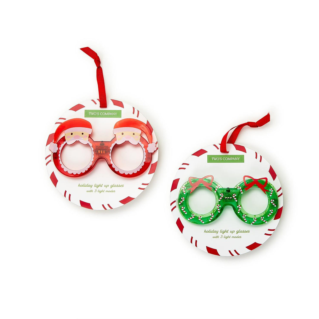 Holiday Cheer Light Up Novelty Glasses: two pairs featuring Santa Claus and wreath designs.