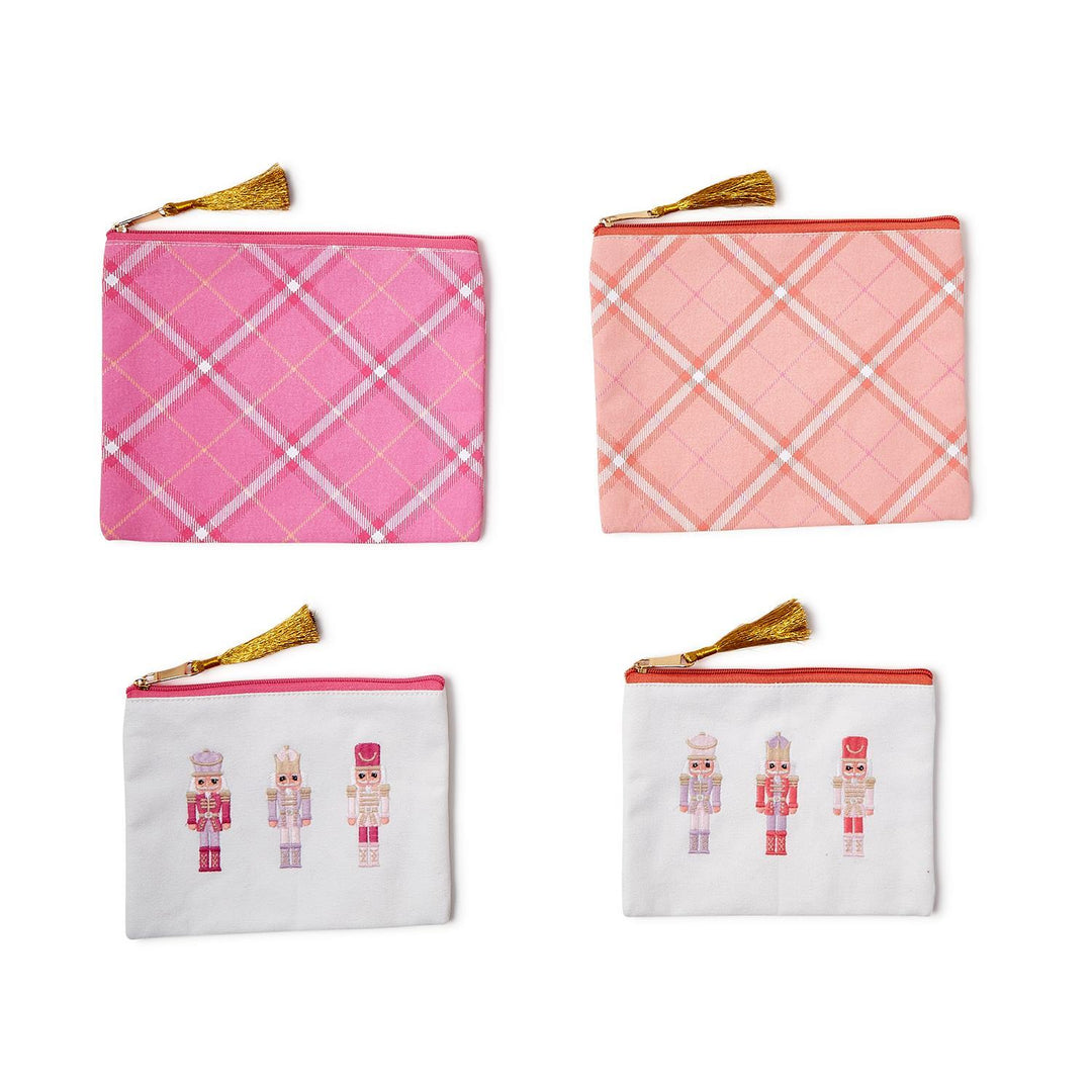 Set of four Nutcracker Pink Sugar multipurpose pouches with gold tassel pulls, featuring two pink and white plaid pouches and two white pouches with embroidered nutcrackers.