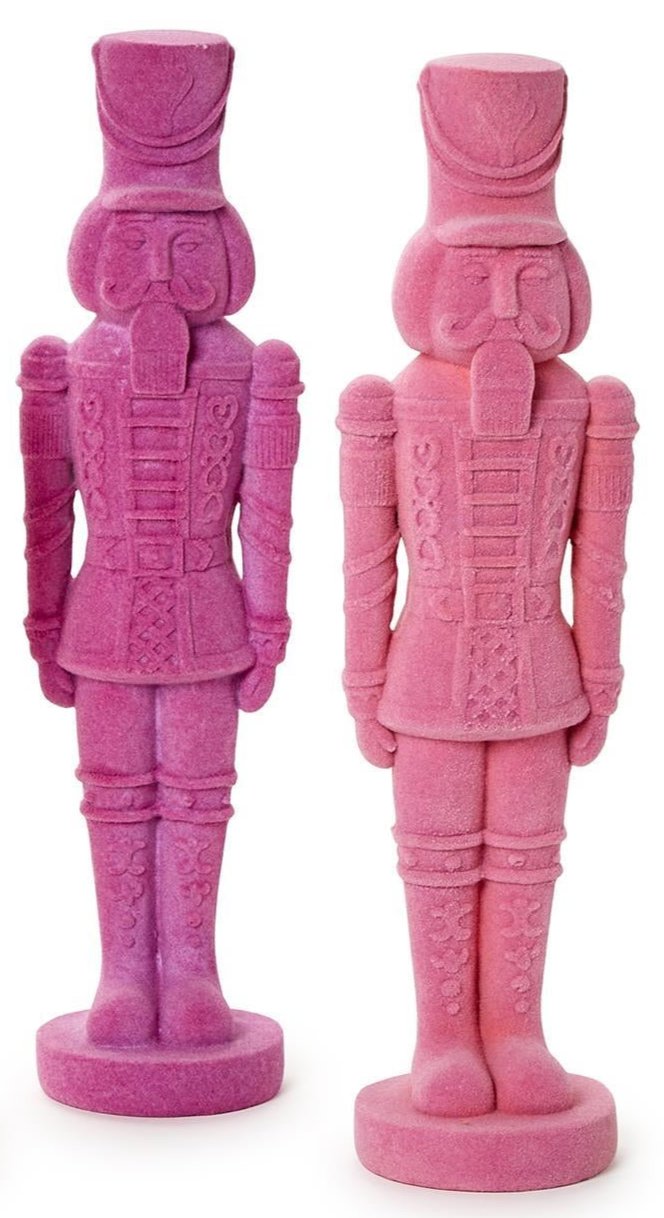 The Flocked Nutcrackers feature vibrant toy soldiers in pink and purple. One size.