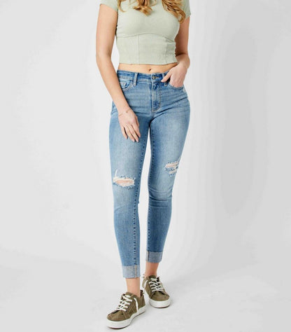 Light green short-sleeved crop top.  
Sizes: XS, S, M, L.

Judy Blue Mid Rise Destroy & Cuffed Skinny Jeans with knee rips.  
Sizes: 0-15 (women's), 14W-24W (plus).