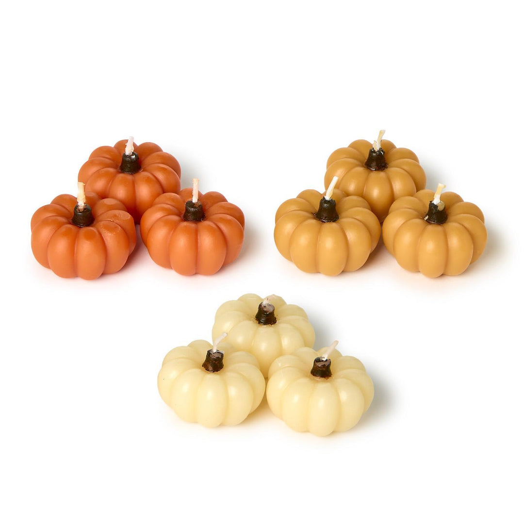 Mini Pumpkin Candles in Gift Box: nine clustered candles in orange, tan, and cream. Available sizes: mini.