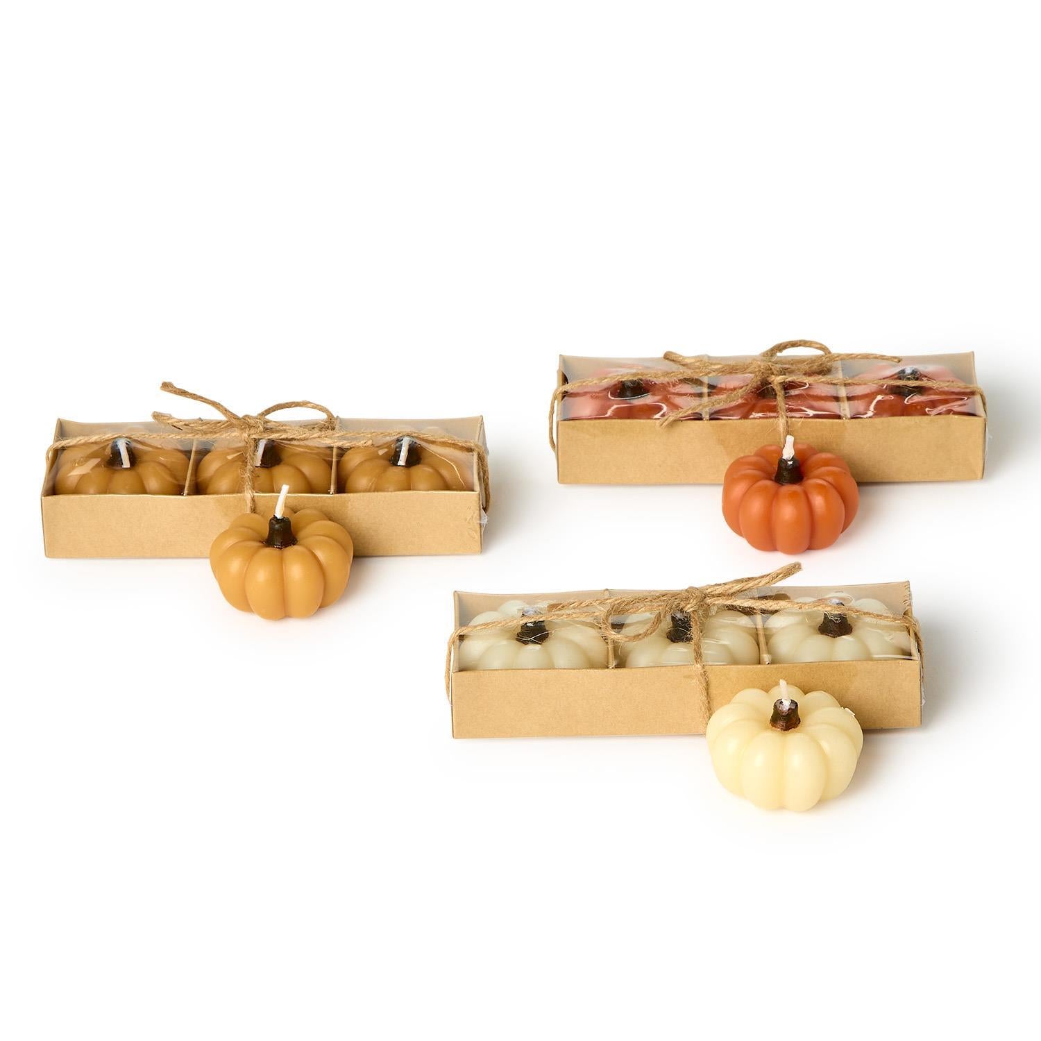 Mini Pumpkin Candles set of 4 in brown, orange, and cream. Twine-tied. Three assorted colors per box. Sizes: mini only.