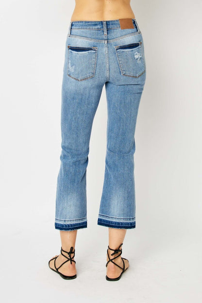 Judy Blue Mid Rise Release Hem Cropped Bootcut Jeans, light blue, frayed hems, minor distressing. Sizes: 0-24.
