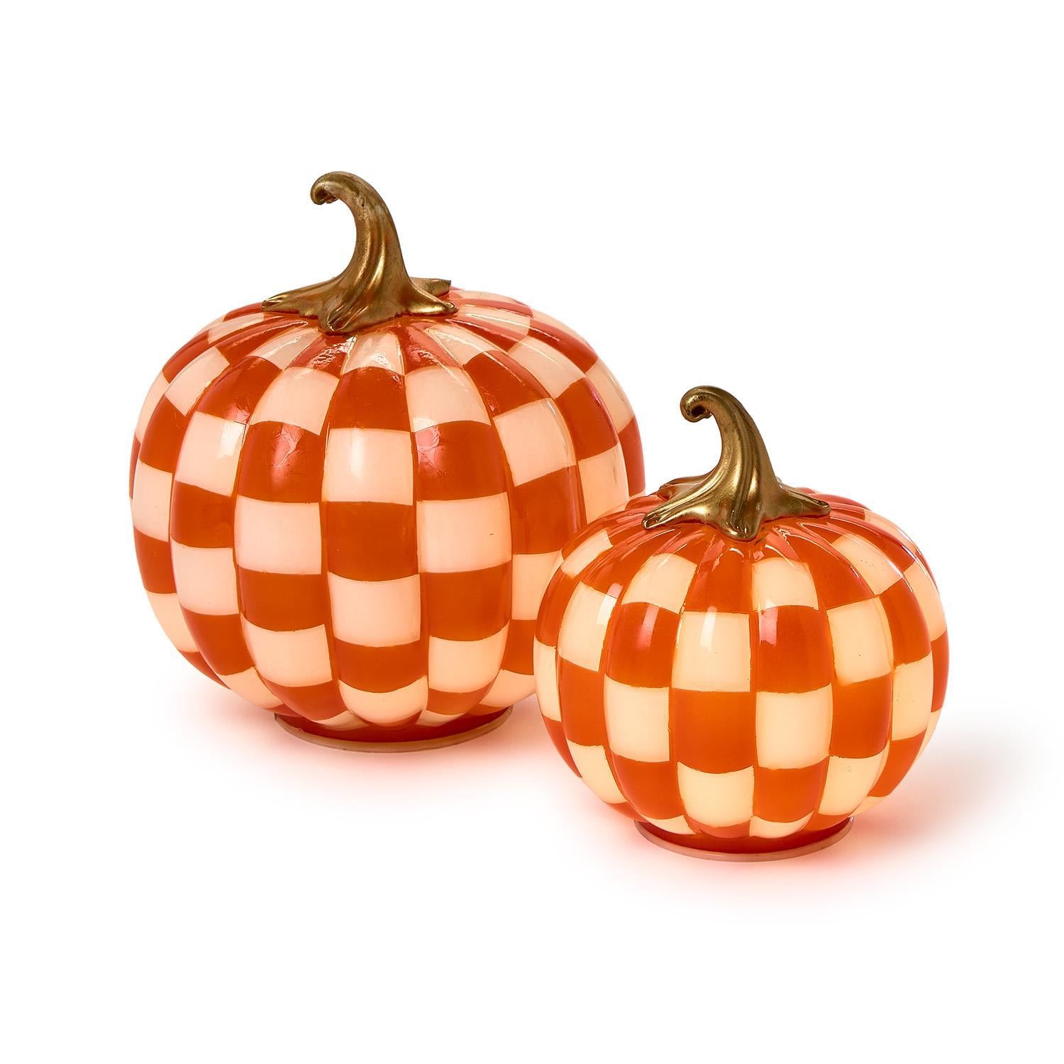 Set of two checkered orange and white LED pumpkins with gold stems; available in large and small sizes.