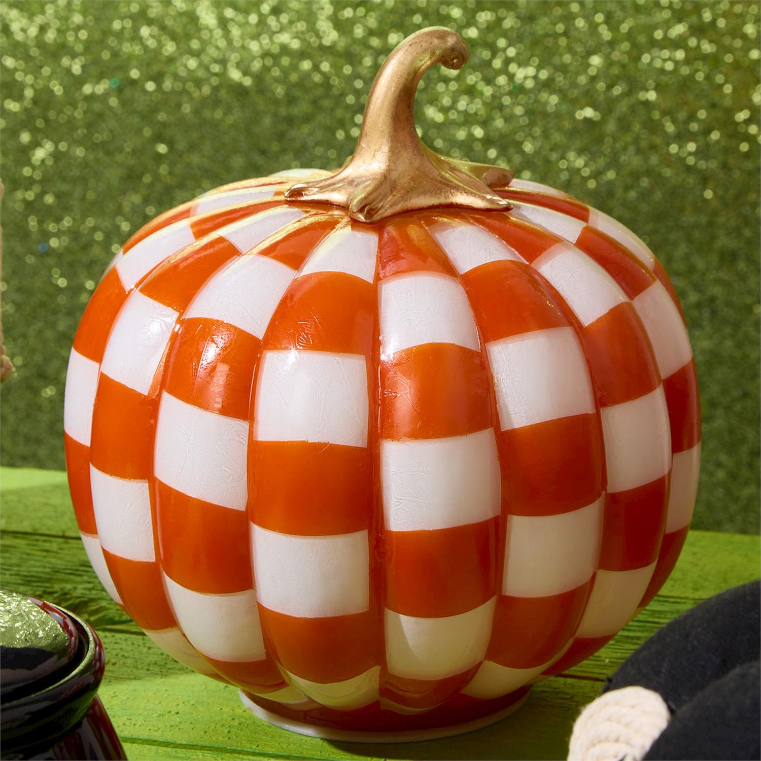 Checkered orange and white light-up LED pumpkin with gold stem, available in small, medium, and large sizes.