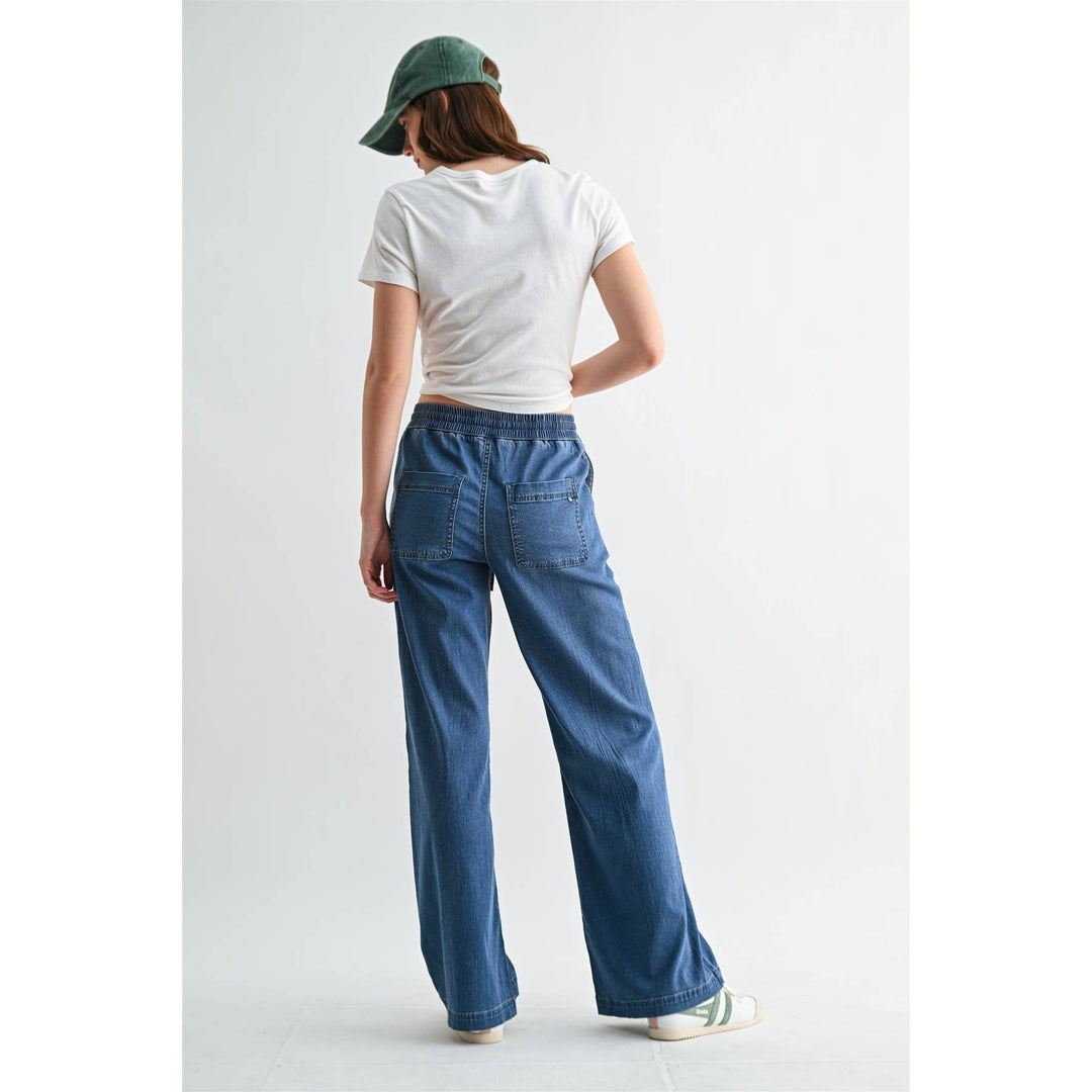 HIGH-RISE WIDE JOGGERS: NAVY EYES / XL are high-rise, wide-leg Lyocell joggers with an elastic waistband and back pockets. Available in size XL.