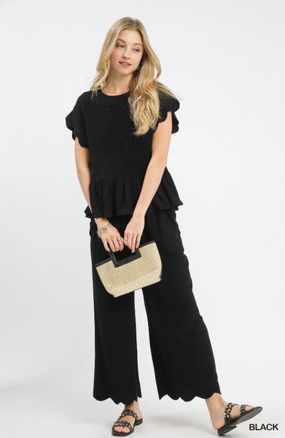 Scallop Wide Leg Pants with elastic waistband, wide-leg silhouette, and scalloped hems. Available in sizes XS-XL.