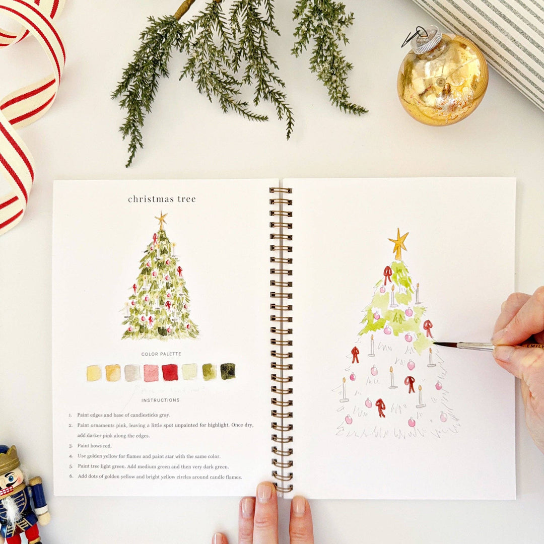 Spiral-bound Nutcracker watercolor workbook with step-by-step instructions and color palette.