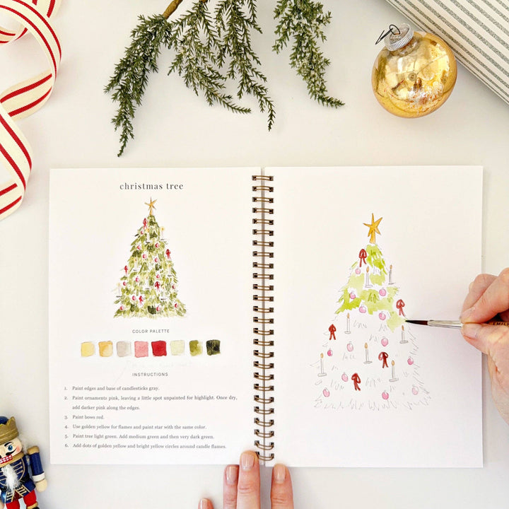 Spiral-bound Nutcracker watercolor workbook with step-by-step instructions and color palette.