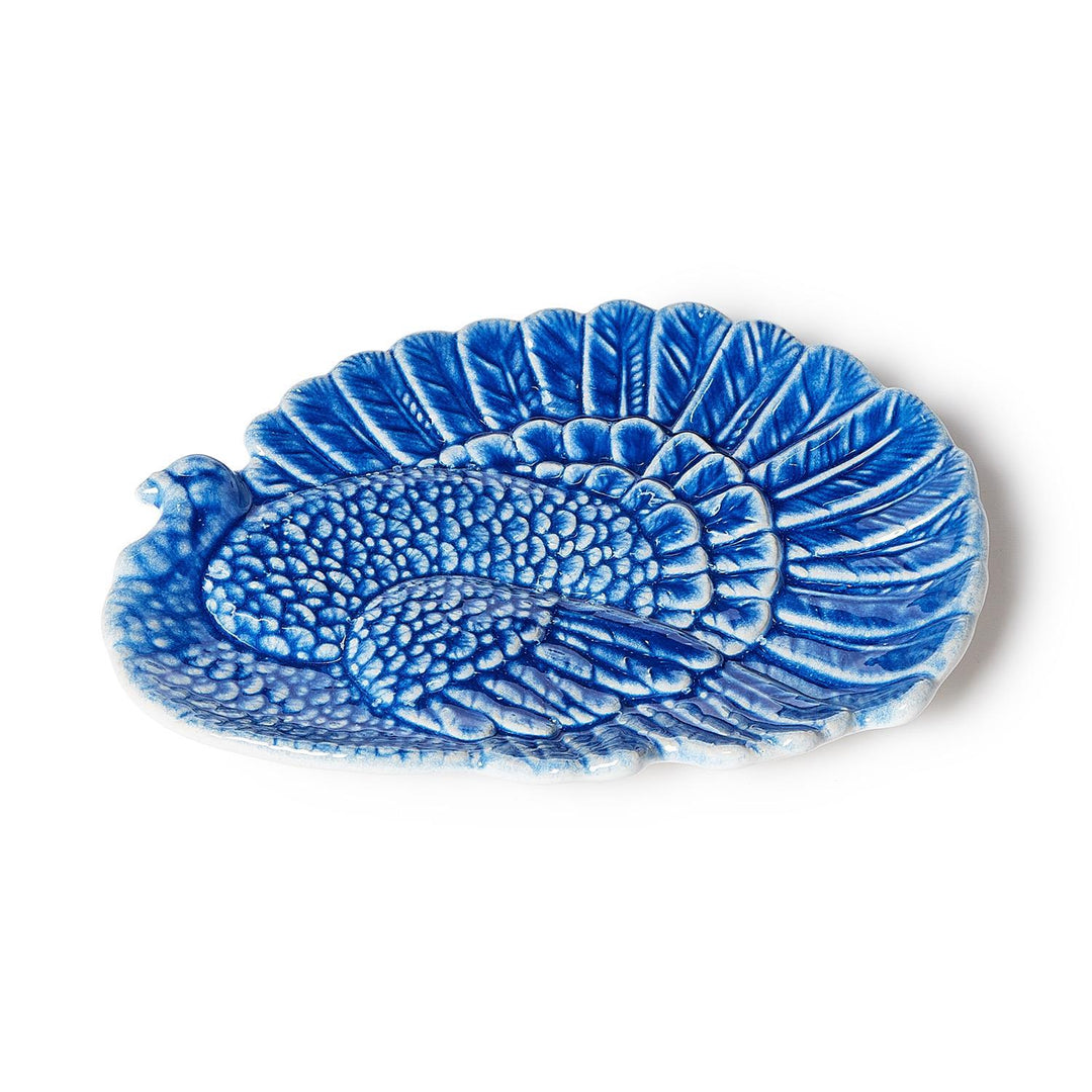 Blue reactive glaze turkey platter in blue ceramic with embossed feather details.