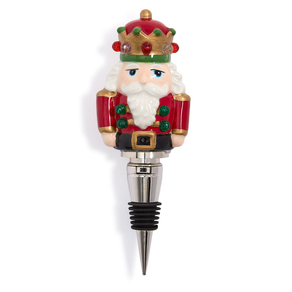 Light-Up LED Nutcracker bottle stopper with red and gold crown, metal spike, and ribbed black stopper.