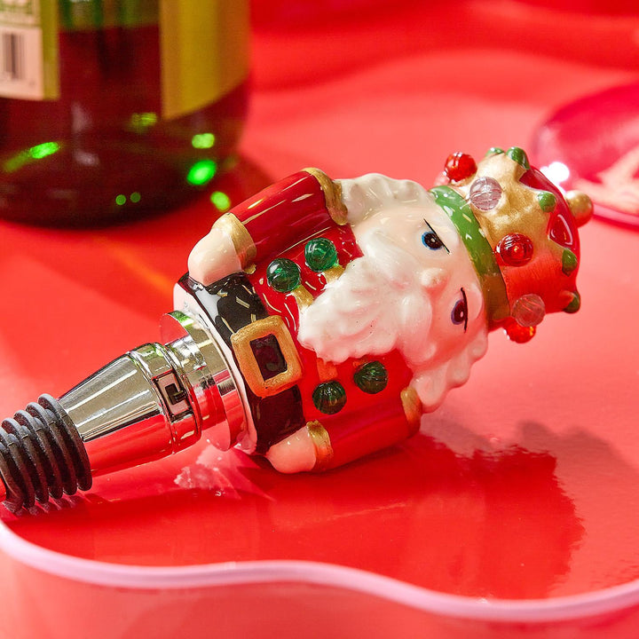 Light-Up LED Nutcracker bottle stopper in red uniform and crown.