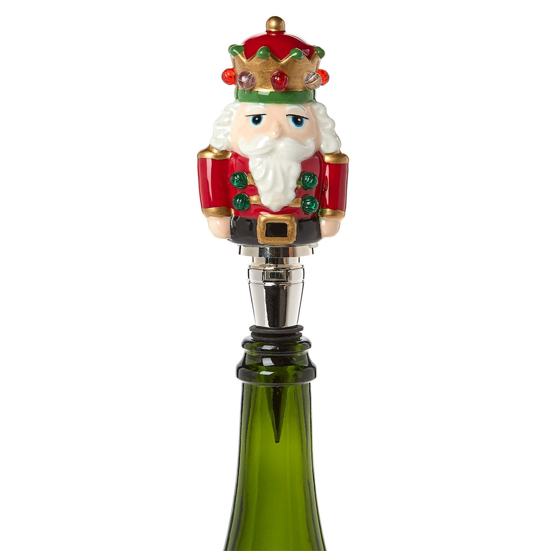 Light-Up LED Nutcracker Bottle Stopper in red coat with crown and white beard.