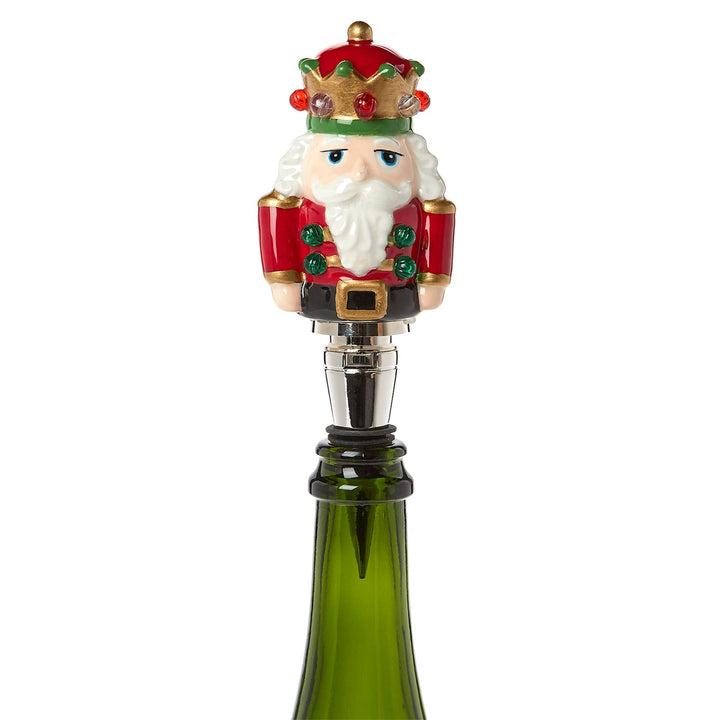 Light-Up LED Nutcracker Bottle Stopper in red coat with crown and white beard.