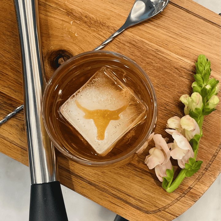 Longhorn Inserts - 3 Pack ice mold with bull’s head design shown in a glass. Available in multiple sizes.