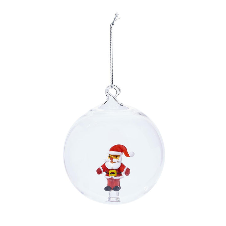 Clear glass spherical ornament with Santa Claus figure on a silver string.